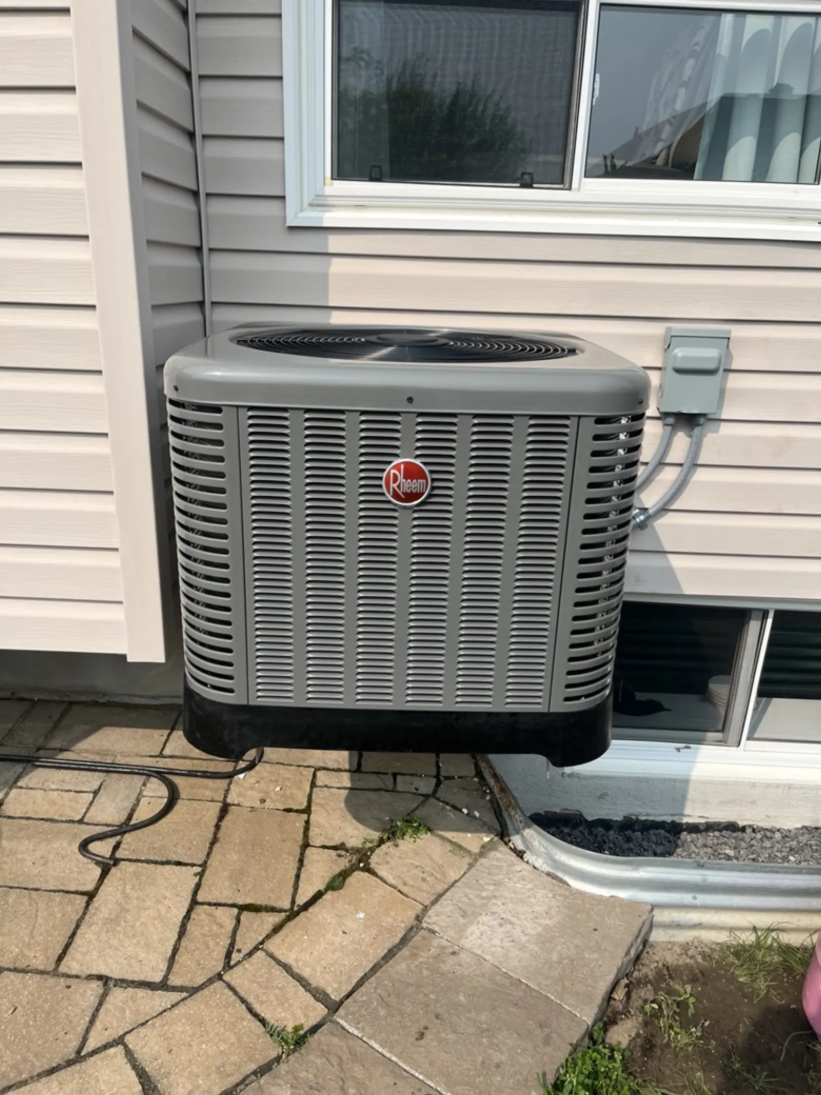Rheem air conditioner installed outside Ottawa home